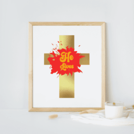 Gold cross with red paint splash with gold font that says "He's Alive"