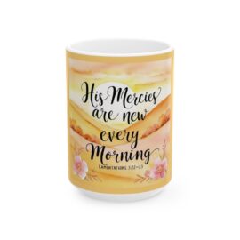 ceramic white coffee mug with overlay text bible verse "His mercies are new every morning, sunrise background.