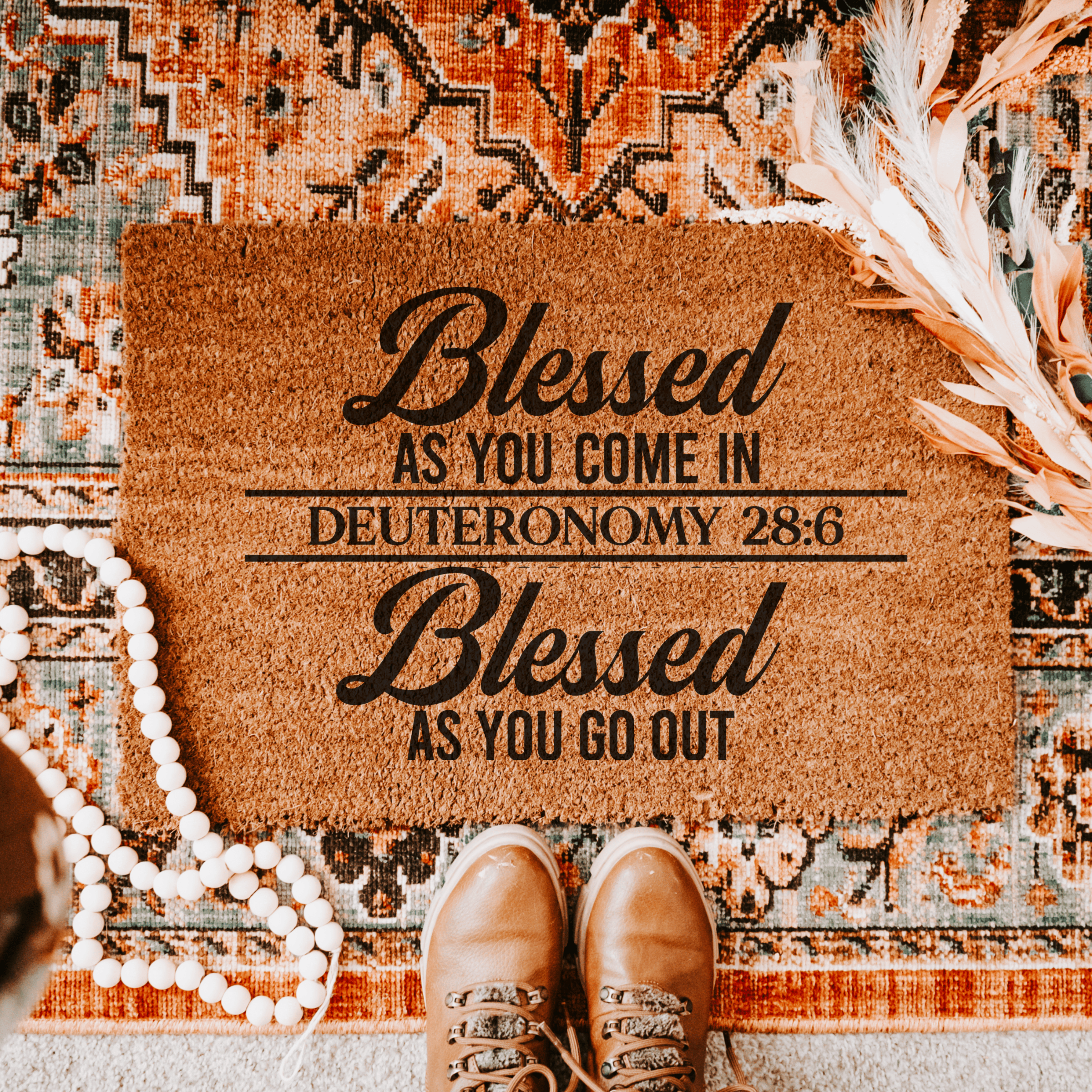 Christian welcome doormat that says “Blessed as you go in and blessed as you go out,” farmhouse-style home décor for front door entryway.