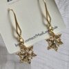Crystal Snowflake Gold Tone Dangle Earrings