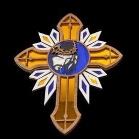 Close-up of laser-engraved Jesus crowned with thorns in blue & gold acrylic medallion, glowing Sacred Heart cross detail, spiritual faith gift