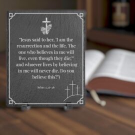 slate engraved scripute plaque with john 11:25 26 on it sitting on a table with candle