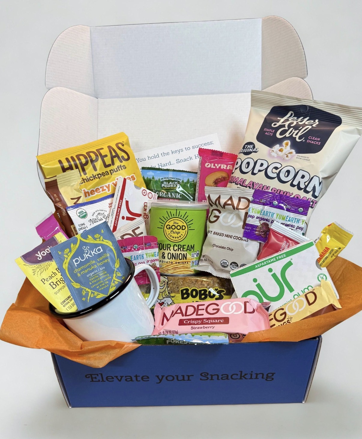 Healthy snack box care package with mug.