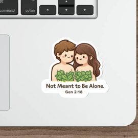 Cute Adam and Eve sticker with leaves and the text “Not Meant to Be Alone Gen 2:18” in kawaii style vinyl decal on a laptop.