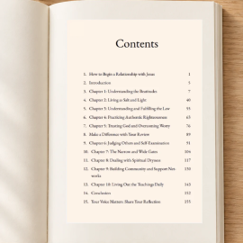 Open Mountaintop Wisdom Bible study showing the table of contents on a light-oak table with greenery and a pen.