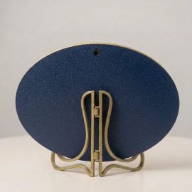 Back view of Psalm 23:1 oval wall plaque showing wooden stand