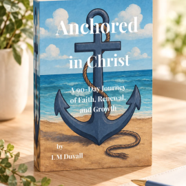 Anchored in Christ: A 90-Day Journey of Faith, Renewal, and Growth by L. M. Duvall. Christian devotional paperback featuring a blue ocean and anchor cover, displayed on a light wooden tabletop with soft natural lighting, greenery, a neutral journal, and a pen.