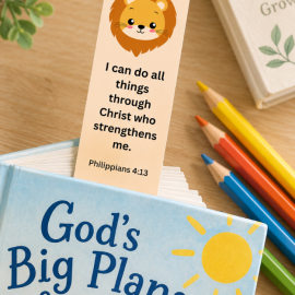 Children’s Philippians 4:13 Christian bookmark with lion design displayed in a children’s book with colored pencils.