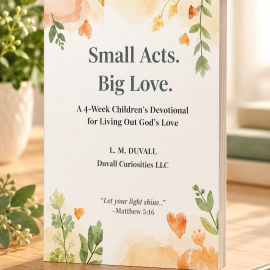 Small Acts, Big Love 4-Week Children’s Christian Devotional by L. M. Duvall, featuring a soft watercolor floral paperback cover displayed on a light natural-oak tabletop with greenery, a journal, and warm natural lighting.
